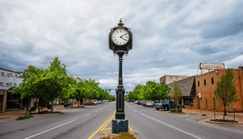 Charming clock in the middle of a square in Edmond
