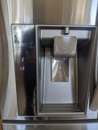 an ice maker on a refrigerator that needs repair